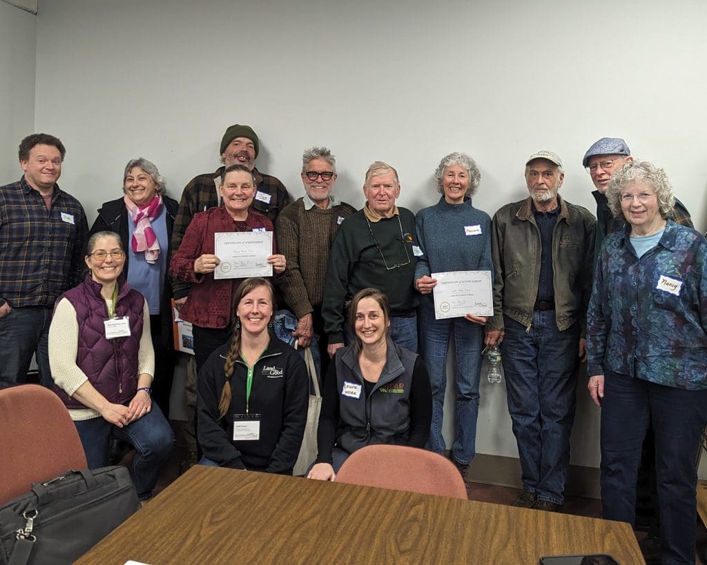 Winter 2024 cohort of senior generation farmers pose for a group picture with Land For Good staff.