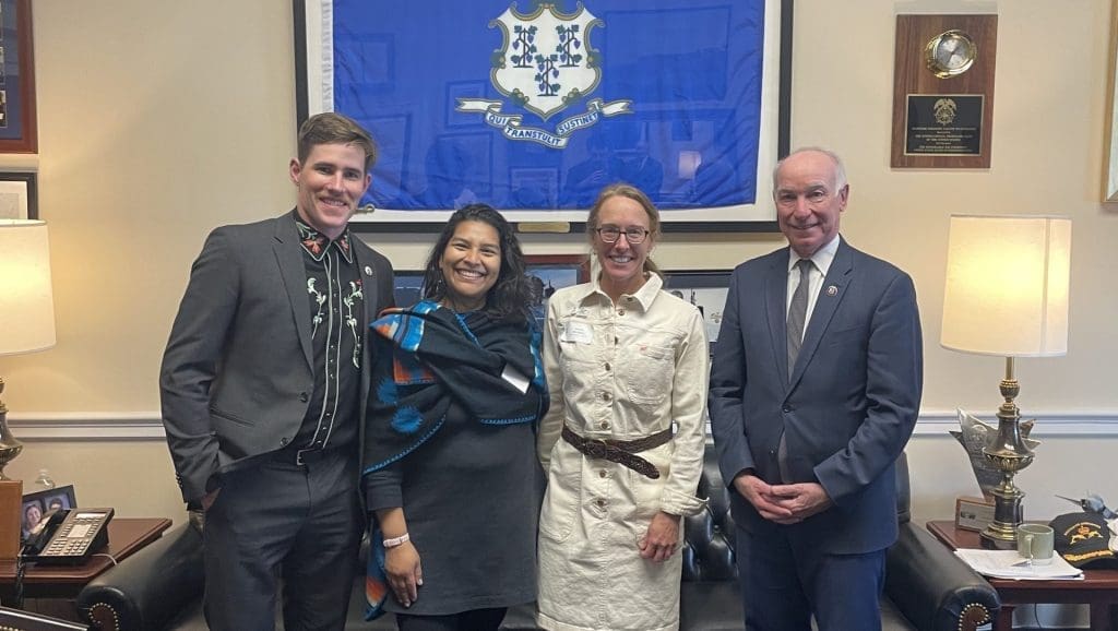 Will O'Meara stands next to Elizabeth Guerra of Seamarron Farmstead, Susan Mitchell of Cloverleigh Farm, and Representative Courtney in Representative Courtney's office in D.C.